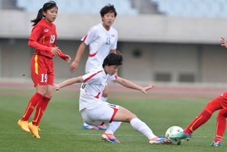 Vietnamese and North Korean players vie for the ball at the AFC Women's Olympic Football Tournament Rio 2016 qualifiers in Japan yesterday.